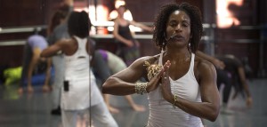 Afro Flow Yoga instructor Leslie Salmon Jones leads the group in a yoga session at the Dance Complex in Cambridge, Mass. (Robin Lubbock/WBUR)